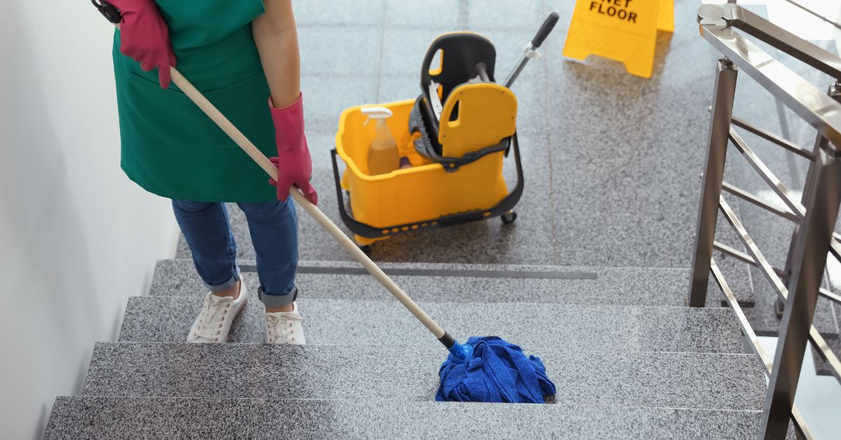 Woman mopping commercial space